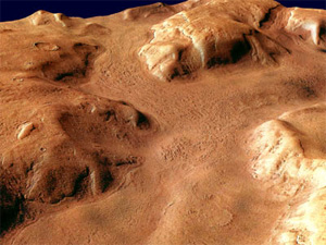 Были времена, когда на Марсе было много воды. Может быть, была и жизнь (на фото: изборожденный каналами район Reull Vallis в южном полушарии Марса). Изображение с сайта www.esa.int